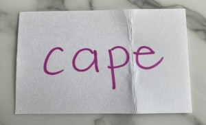 index card with the word cape, there is a fold line before the e
